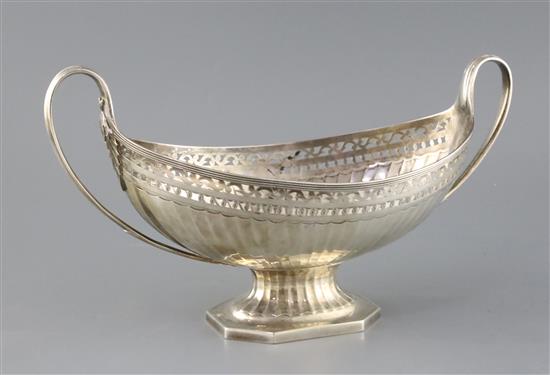 A George III pierced silver two handled boat shaped pedestal fruit bowl, by Henry Chawner, 22oz.